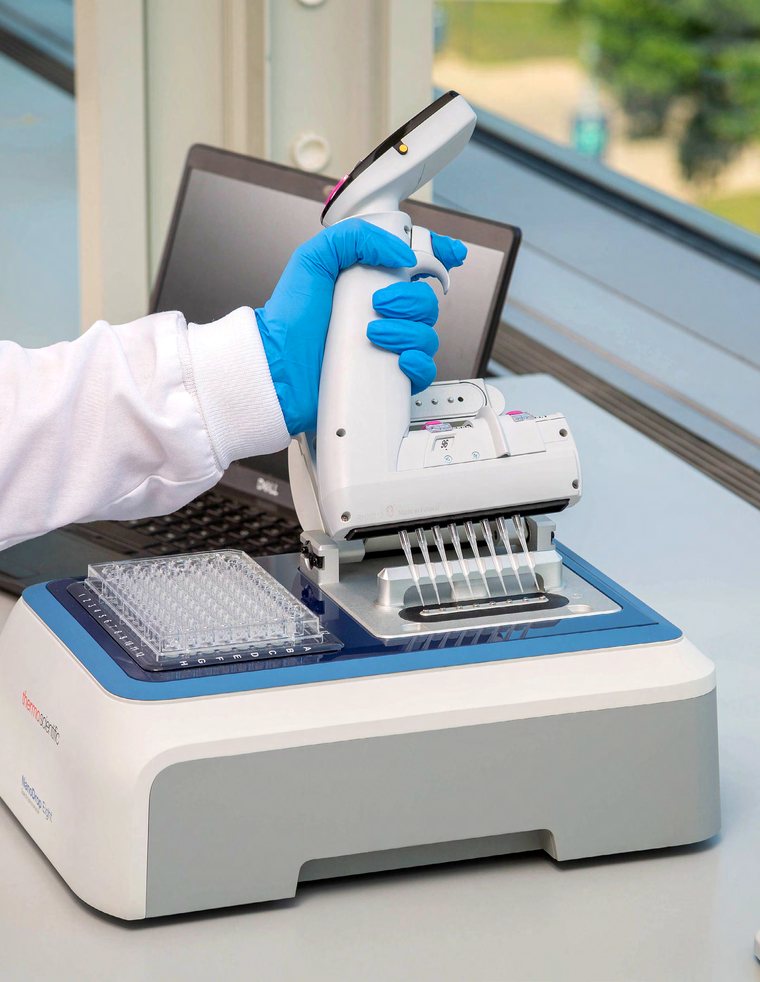 Loading eight samples onto NanoDrop Eight with an eight-channel pipette