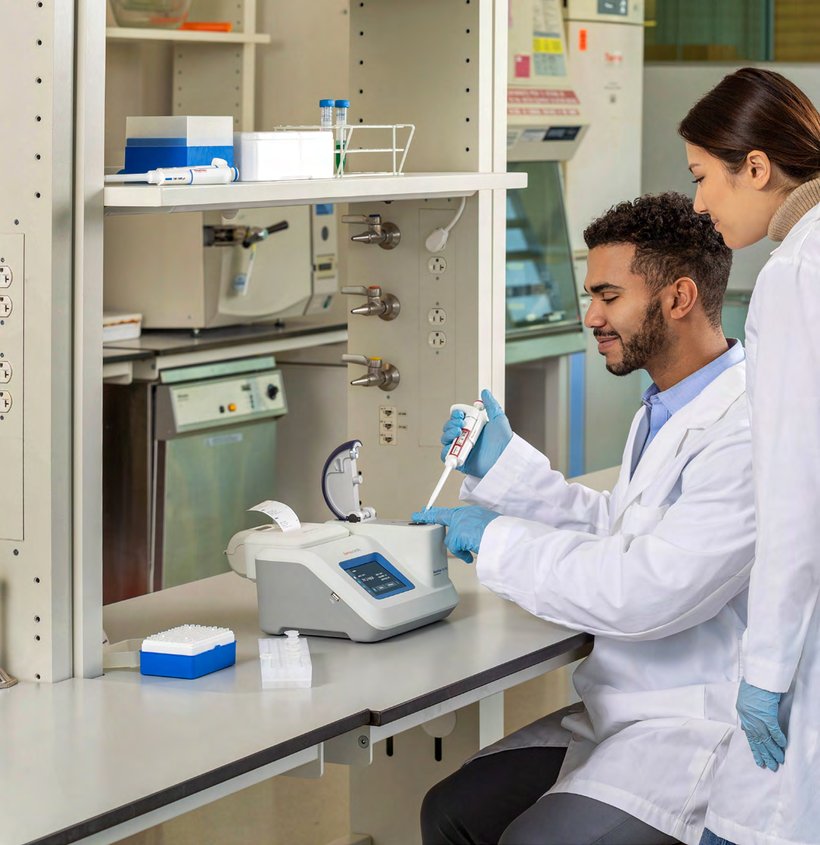 Researchers using the NanoDrop LitePlus spectrophotometer at the bench